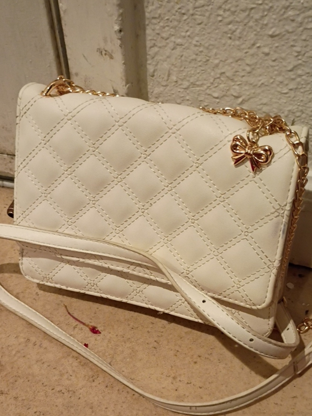 Quilted White Crossbody Bag with Gold Bow Charm